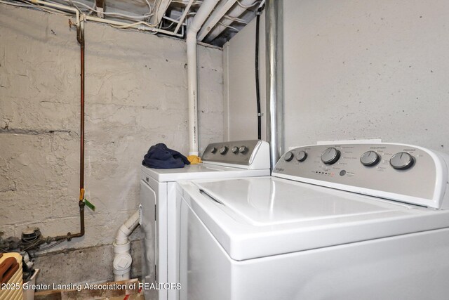 washroom featuring laundry area and washer and clothes dryer