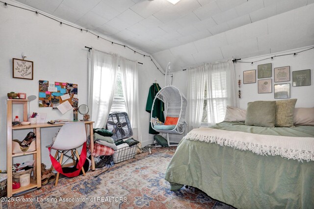 bedroom with lofted ceiling