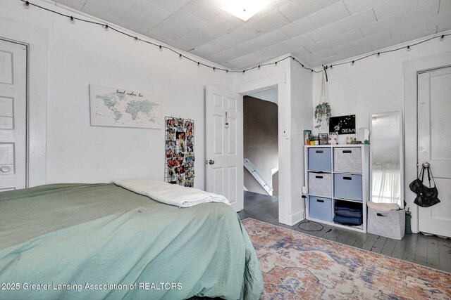 bedroom featuring dark wood-style floors