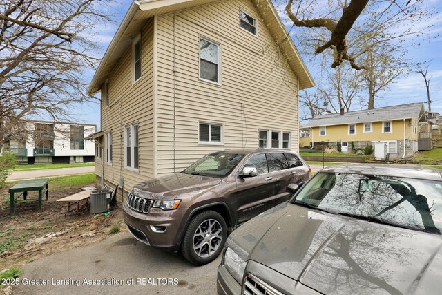 view of side of property featuring cooling unit