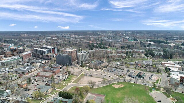 birds eye view of property featuring a view of city