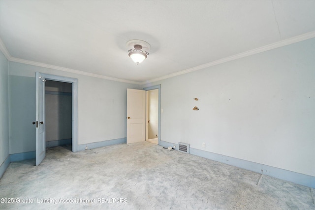 12102 Rupp Rd, Grand Ledge, MI 48837 - unfurnished bedroom featuring crown molding, light colored carpet, baseboards, and a closet