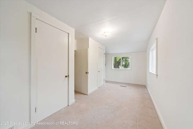 12102 Rupp Rd, Grand Ledge, MI 48837 - unfurnished bedroom featuring light colored carpet and baseboards