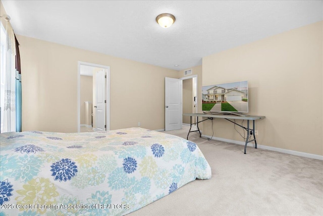 609 E Avocet Dr, East Lansing, MI 48823 - carpeted bedroom featuring baseboards