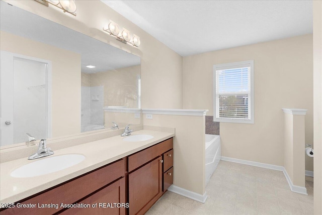 609 E Avocet Dr, East Lansing, MI 48823 - full bath featuring baseboards, double vanity, and a bath