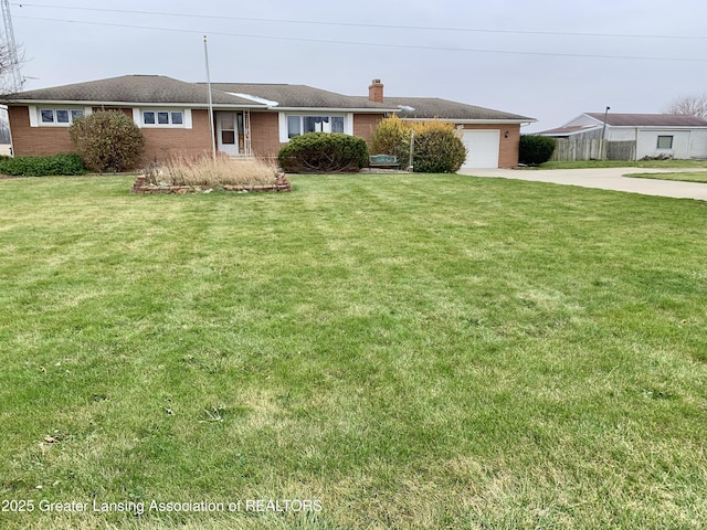 3156 E M-21 Rd, Saint Johns, MI 48879 - single story home with a front yard, concrete driveway, a garage, and a chimney