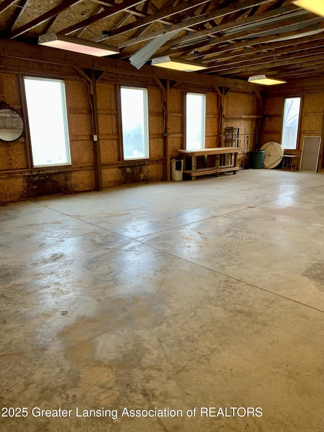 3156 E M-21 Rd, Saint Johns, MI 48879 - miscellaneous room featuring a healthy amount of sunlight and concrete floors