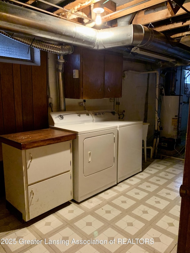 3156 E M-21 Rd, Saint Johns, MI 48879 - laundry area with light floors, washing machine and clothes dryer, and cabinet space