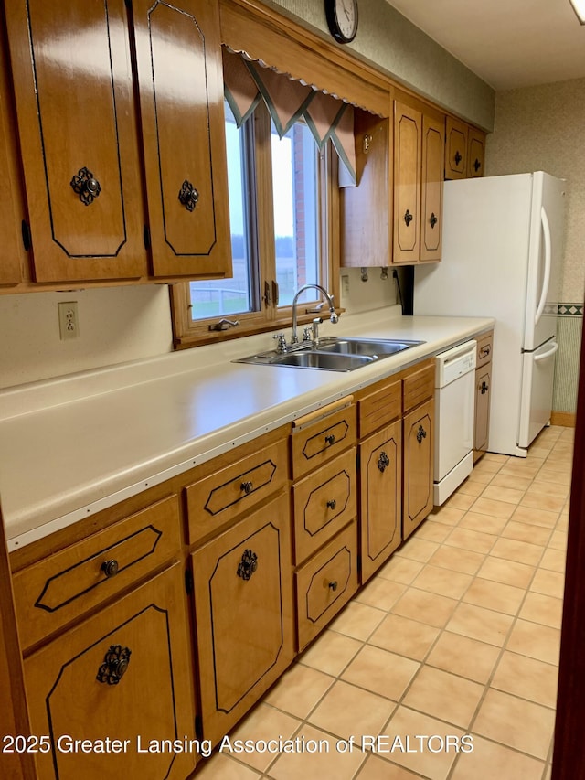3156 E M-21 Rd, Saint Johns, MI 48879 - kitchen featuring a sink, brown cabinets, light countertops, and white dishwasher