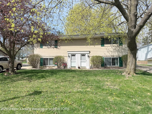 bi-level home with a front yard