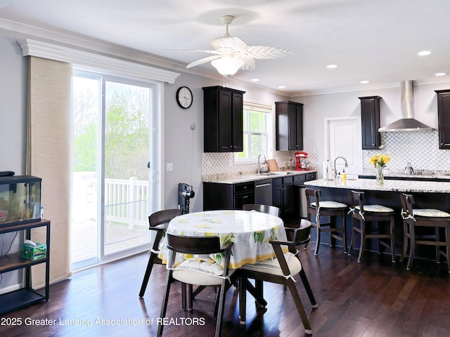 2718 Kittansett Dr, Okemos, MI 48864 - dining space featuring ceiling fan, ornamental molding, and dark wood-type flooring