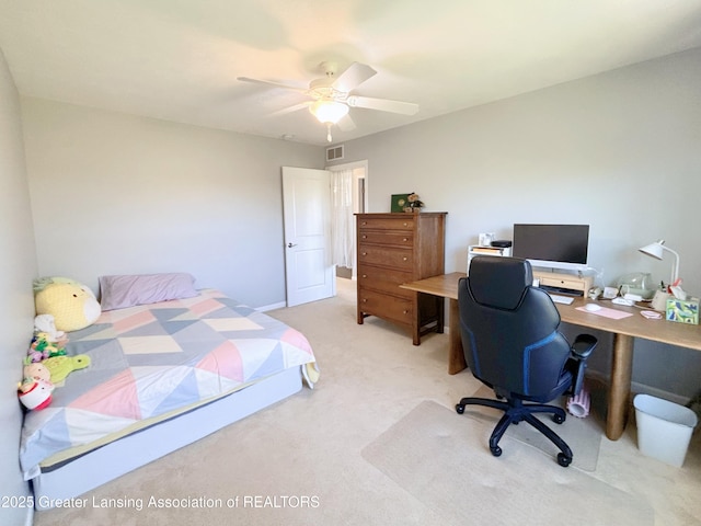 2718 Kittansett Dr, Okemos, MI 48864 - bedroom with light colored carpet, a desk, and a ceiling fan