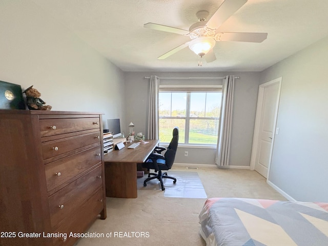 2718 Kittansett Dr, Okemos, MI 48864 - bedroom with light colored carpet, an office area, baseboards, and a ceiling fan