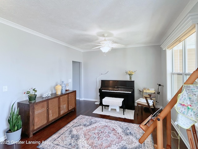 2718 Kittansett Dr, Okemos, MI 48864 - living area featuring dark wood finished floors, a ceiling fan, baseboards, and crown molding