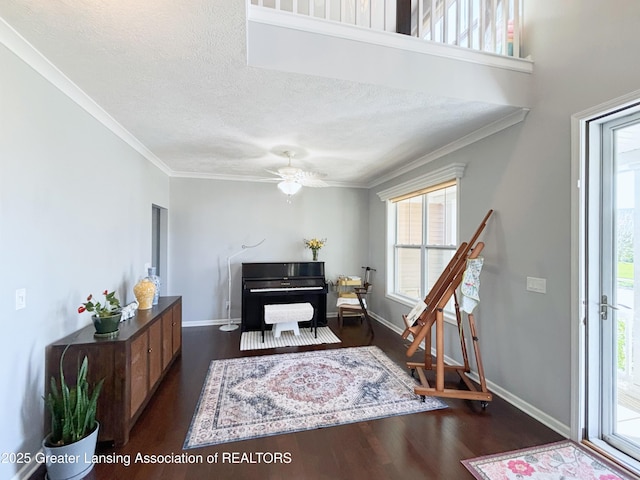 2718 Kittansett Dr, Okemos, MI 48864 - entryway featuring dark wood-style flooring, baseboards, ornamental molding, a textured ceiling, and a ceiling fan