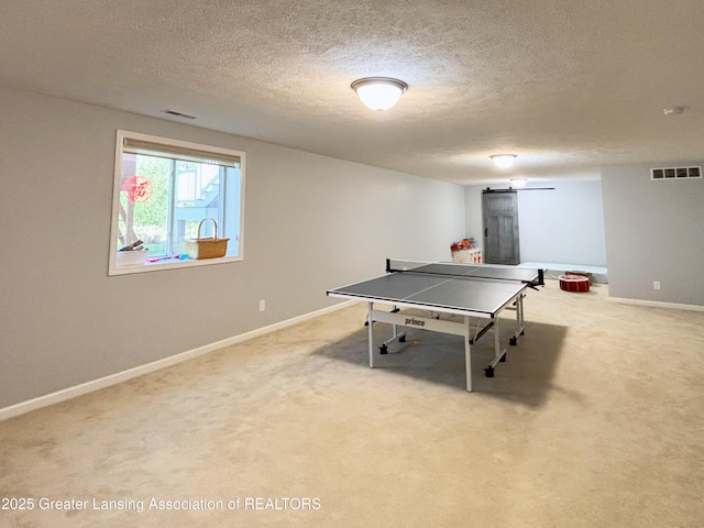2718 Kittansett Dr, Okemos, MI 48864 - game room with a textured ceiling, carpet flooring, and baseboards