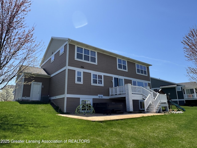 2718 Kittansett Dr, Okemos, MI 48864 - back of house featuring a wooden deck, a lawn, a patio area, and stairs