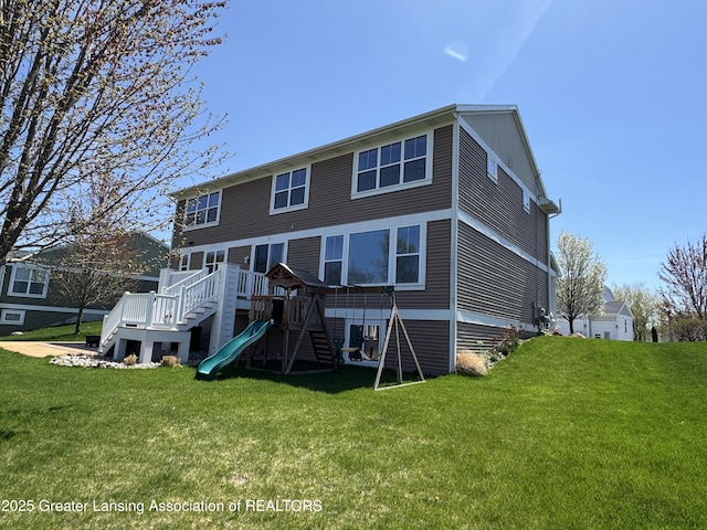 2718 Kittansett Dr, Okemos, MI 48864 - rear view of house featuring a yard