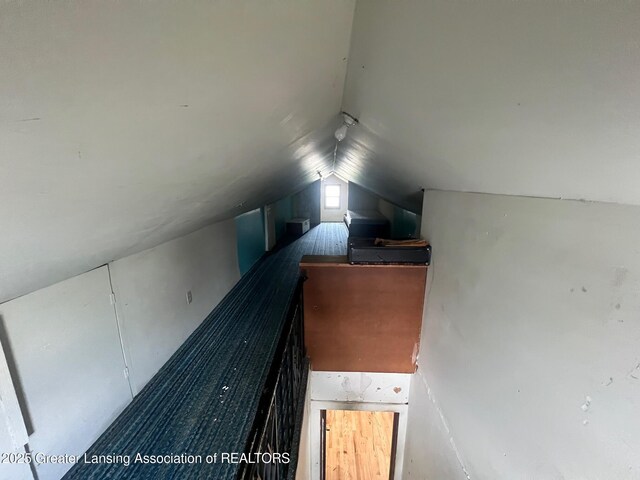unfurnished bedroom with vaulted ceiling