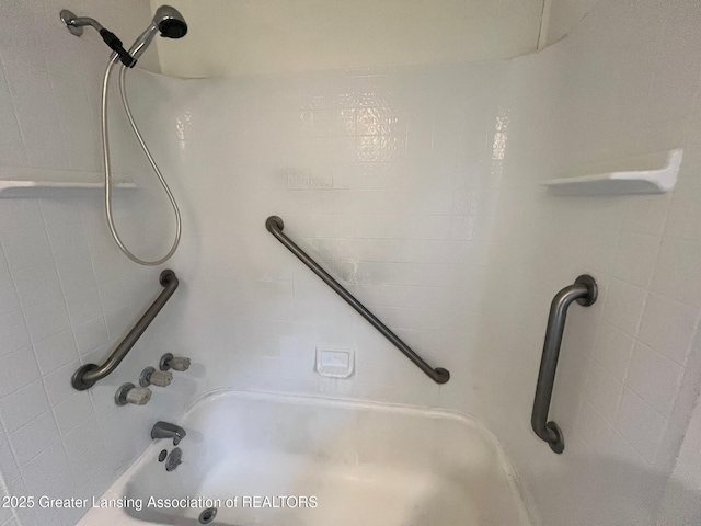 bathroom with bathing tub / shower combination