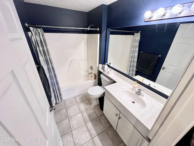 full bathroom featuring tile patterned flooring, shower / bathtub combination with curtain, toilet, vanity, and a textured ceiling