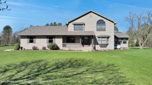 11267 Jarvis Hwy, Dimondale, MI 48821 - traditional home with covered porch, roof with shingles, a sunroom, and a front yard
