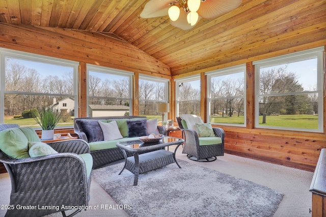 11267 Jarvis Hwy, Dimondale, MI 48821 - living room featuring wood ceiling, a ceiling fan, vaulted ceiling, wood walls, and carpet flooring