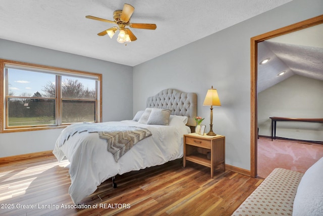 11267 Jarvis Hwy, Dimondale, MI 48821 - bedroom featuring a ceiling fan, a textured ceiling, wood finished floors, baseboards, and lofted ceiling