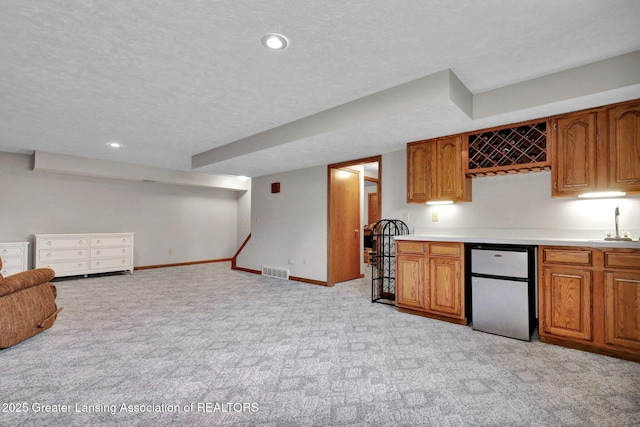 11267 Jarvis Hwy, Dimondale, MI 48821 - bar with light colored carpet, visible vents, fridge, baseboards, and indoor wet bar