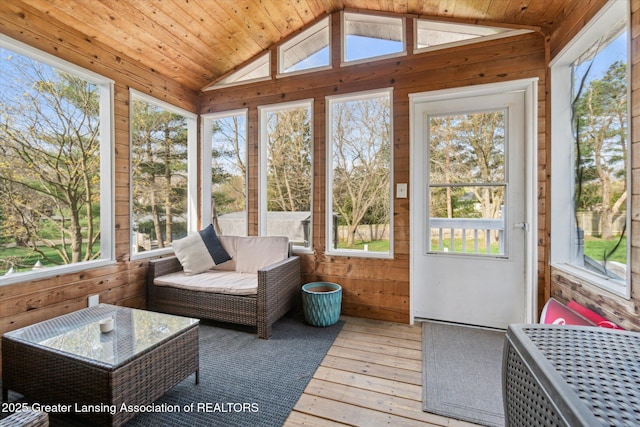 1310 Schavey Rd, Dewitt, MI 48820 - sunroom / solarium featuring wood walls, hardwood / wood-style flooring, and lofted ceiling