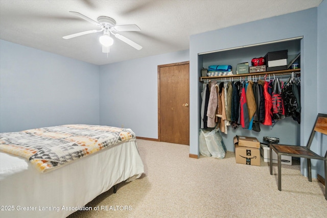 1310 Schavey Rd, Dewitt, MI 48820 - carpeted bedroom with a closet, ceiling fan, and baseboards