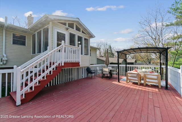 1310 Schavey Rd, Dewitt, MI 48820 - wooden terrace featuring a sunroom and outdoor dining area