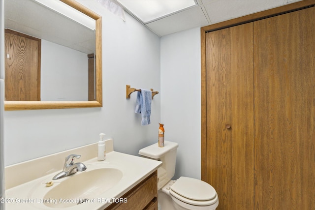 bathroom featuring toilet and vanity