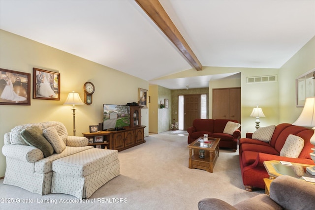 living room featuring visible vents, vaulted ceiling with beams, and light carpet