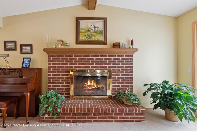 room details featuring a fireplace and carpet flooring