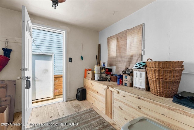 miscellaneous room with wood finished floors