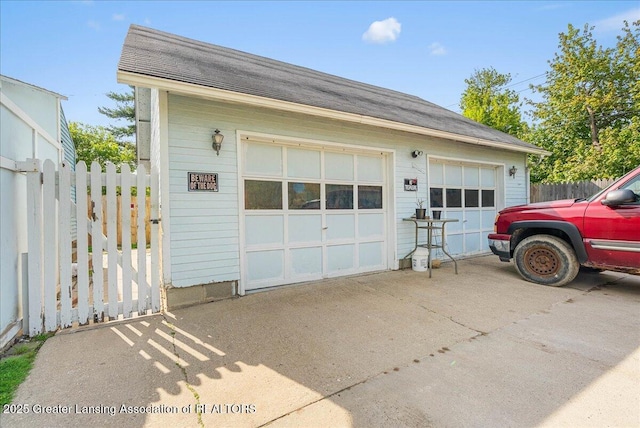 detached garage with fence
