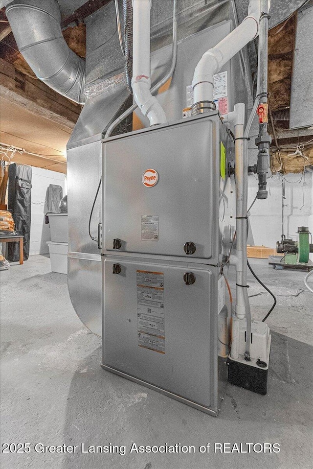 utility room featuring heating unit