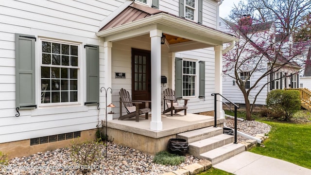 property entrance featuring covered porch