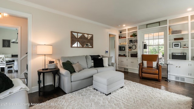 living area featuring wood finished floors, visible vents, recessed lighting, and ornamental molding