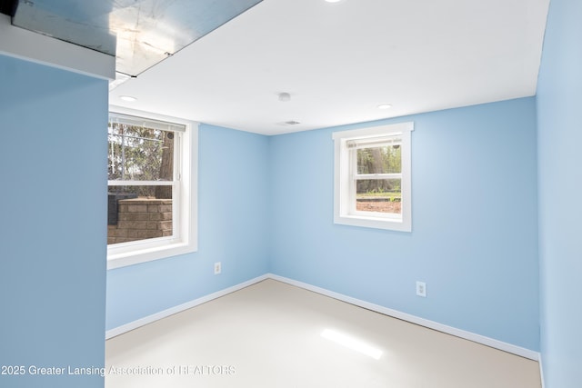 empty room featuring recessed lighting, baseboards, and a healthy amount of sunlight