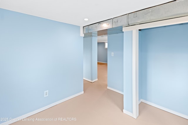 interior space featuring recessed lighting and baseboards