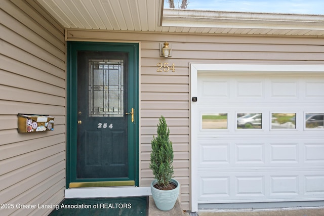 doorway to property featuring a garage