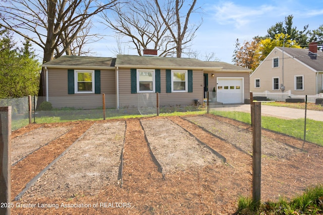 view of front facade with a garage, fence, a chimney, and concrete driveway