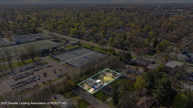 birds eye view of property with a wooded view
