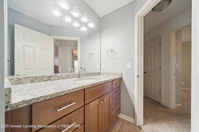bathroom featuring vanity and baseboards