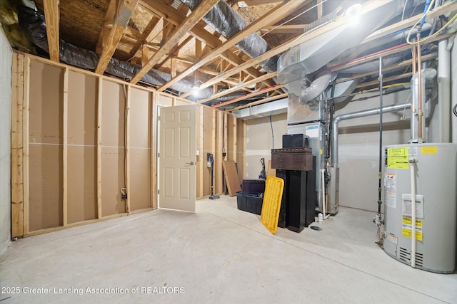 unfinished basement featuring gas water heater and heating unit