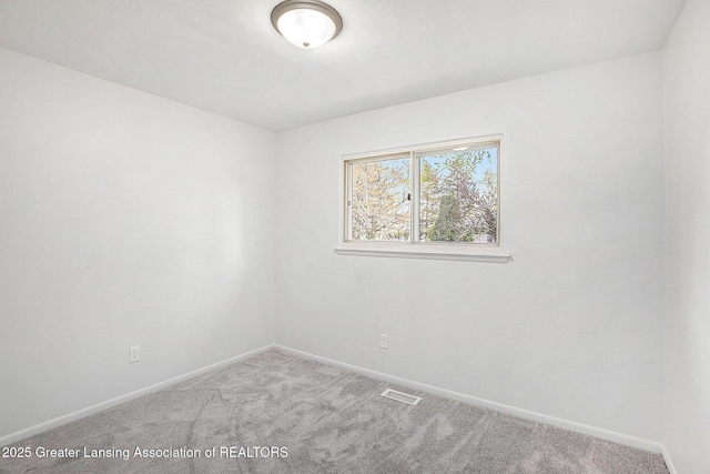 601/603 Farmstead Ln, Lansing, MI 48917 - spare room featuring carpet flooring, visible vents, and baseboards