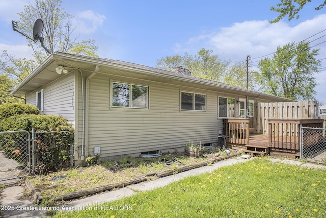 601/603 Farmstead Ln, Lansing, MI 48917 - view of side of property with a deck and a gate