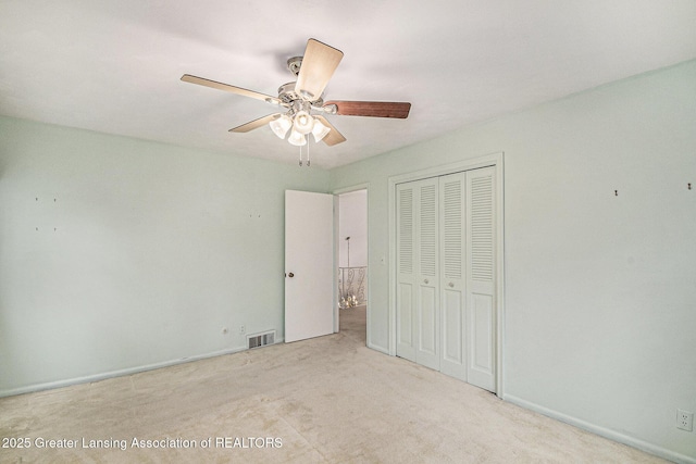 6528 Old River Trl, Lansing, MI 48917 - unfurnished bedroom with ceiling fan, carpet flooring, a closet, and visible vents